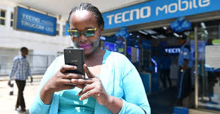 A black woman using Tecno phone